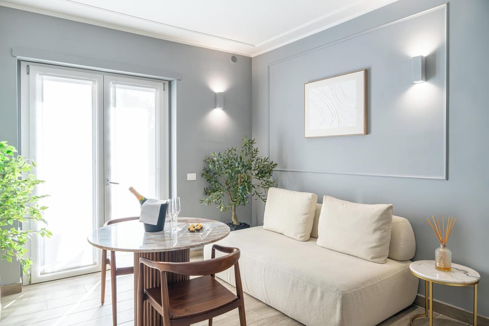 Deluxe Apartment, Balcony, Garden View | Living area | 40-inch Smart TV with cable channels, heated floors