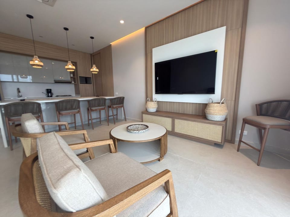 Deluxe Apartment, Balcony, Sea View | Living area | Flat-screen TV