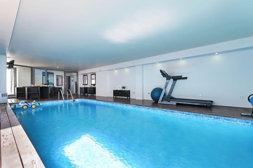Indoor pool, pool umbrellas, sun loungers