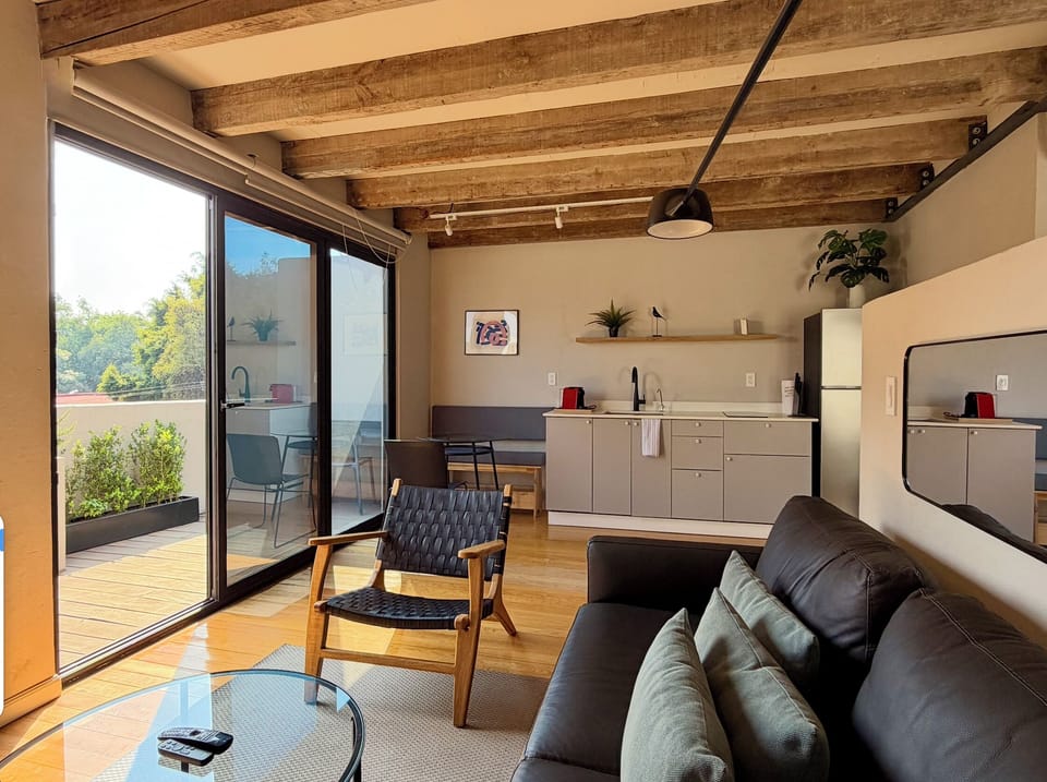 Comfort Loft, City View | Living area | 55-inch Smart TV with digital channels