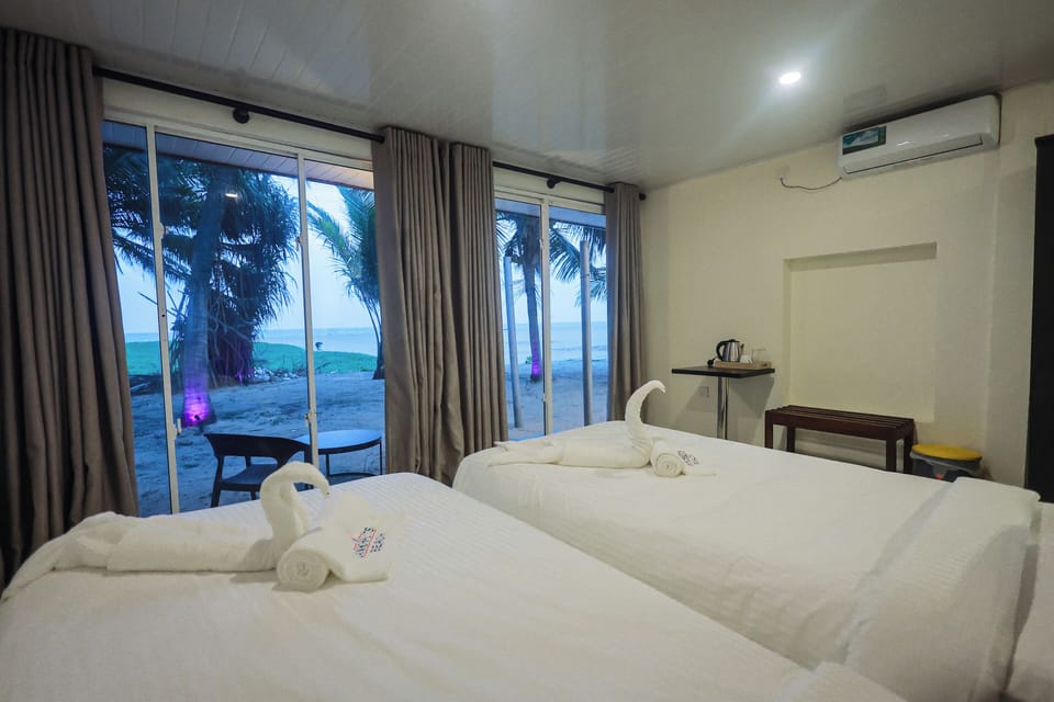 Standard Room, Beachfront | In-room safe, desk, laptop workspace, soundproofing