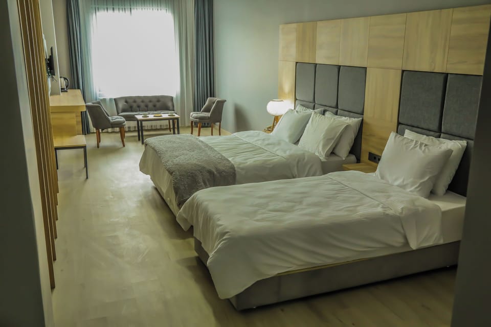 Deluxe Triple Room, Mountain View | Premium bedding, in-room safe, desk, laptop workspace