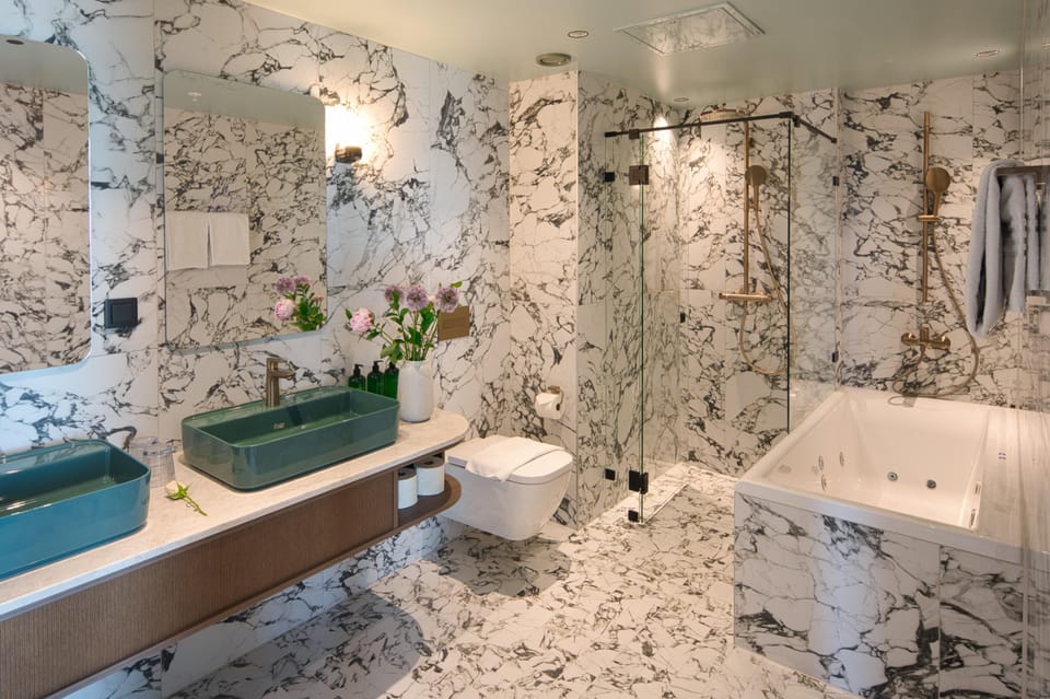Penthouse King Suite with Balcony and Sea View including spa & pool club access | Bathroom | Hair dryer, towels, soap, shampoo
