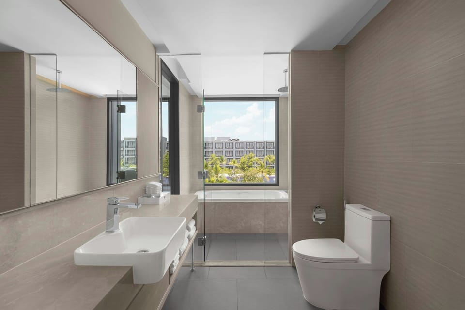 Family Room, 1 King Bed with Sofa bed | Bathroom | Free toiletries, hair dryer, bathrobes, slippers