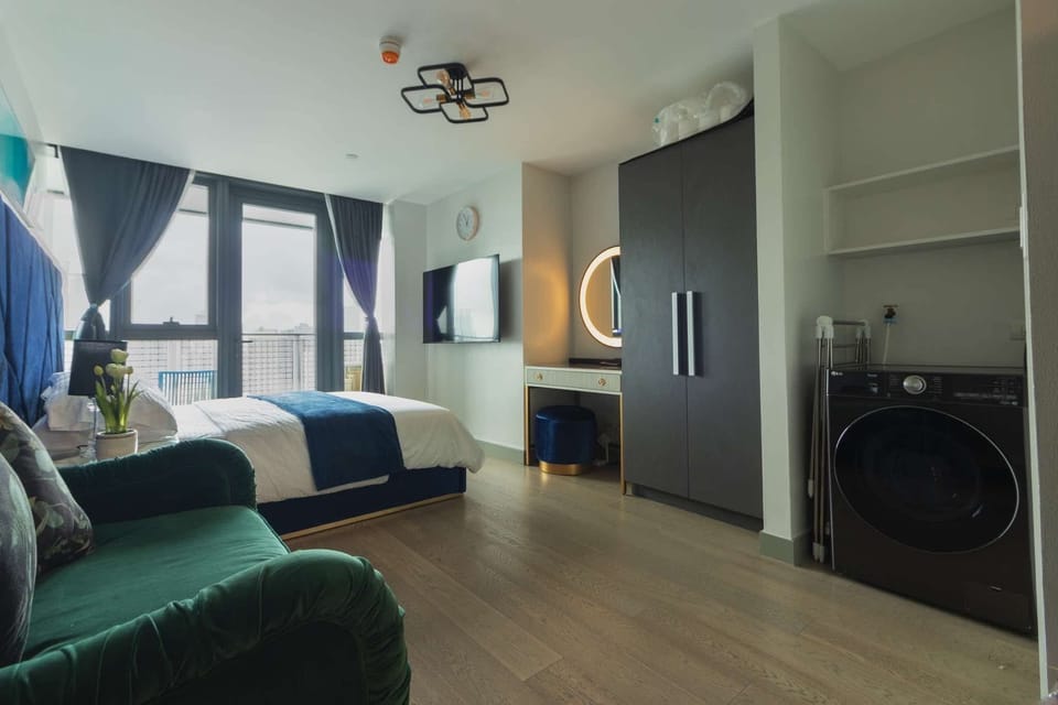 Deluxe Condo, City View | Blackout drapes, soundproofing, iron/ironing board, free WiFi