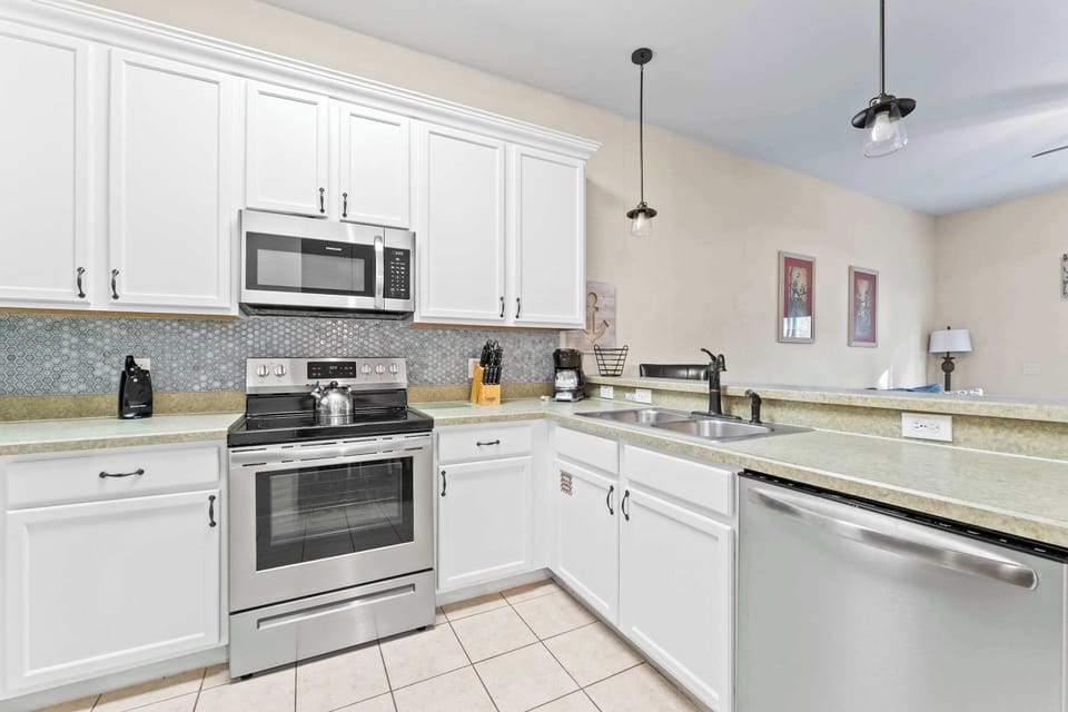 Condo, Multiple Beds, Patio, Garden View (Serenity at Bahama Bay) | Private kitchen | Coffee/tea maker