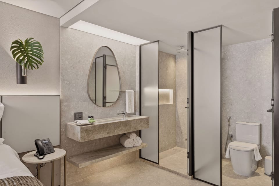 Shower, rainfall showerhead, designer toiletries, hair dryer