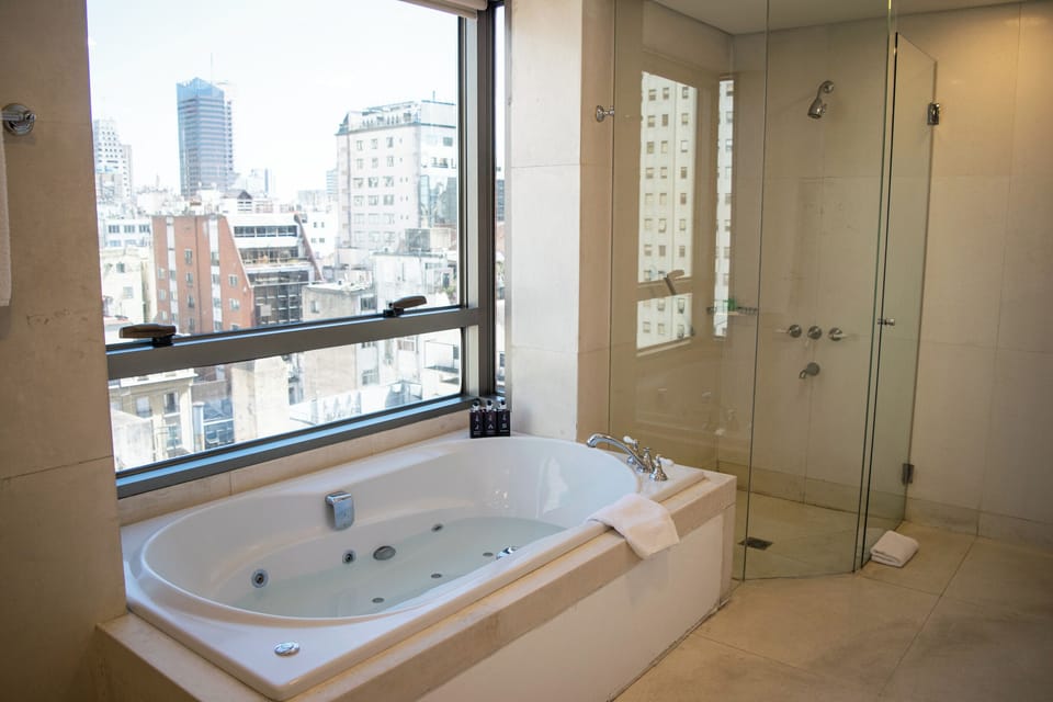 Master Suite | Bathroom | Deep soaking tub, rainfall showerhead, free toiletries, hair dryer