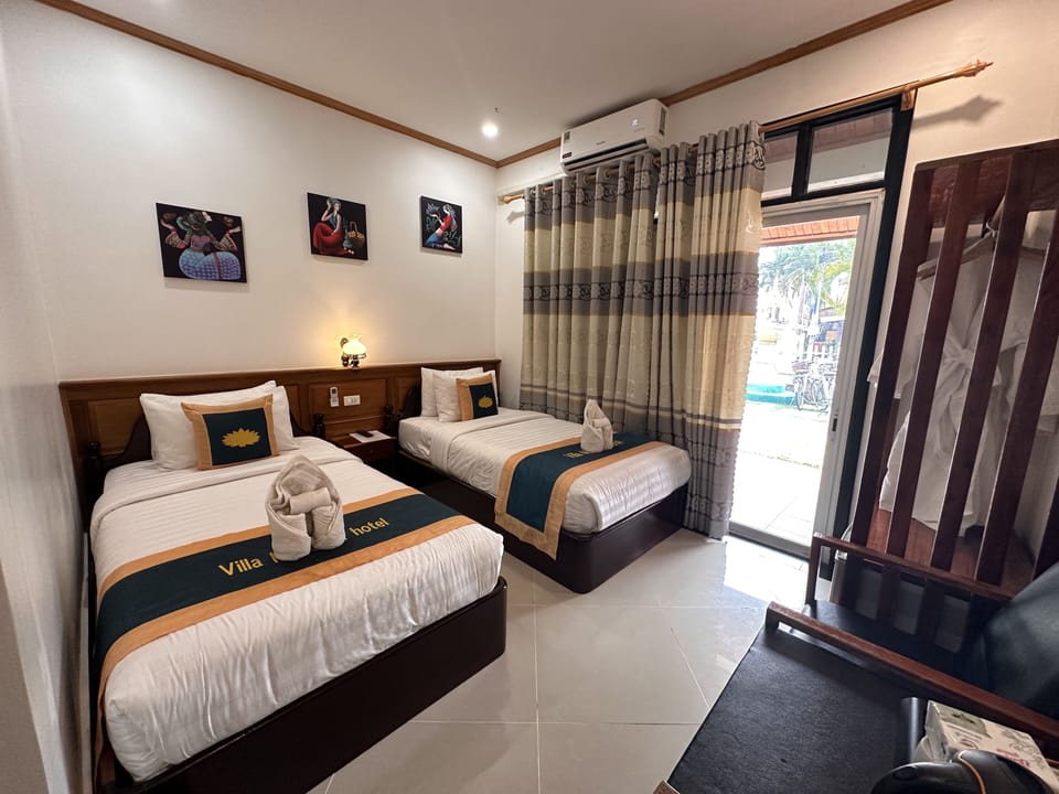 Standard Twin Room | Minibar, in-room safe, blackout drapes, free WiFi