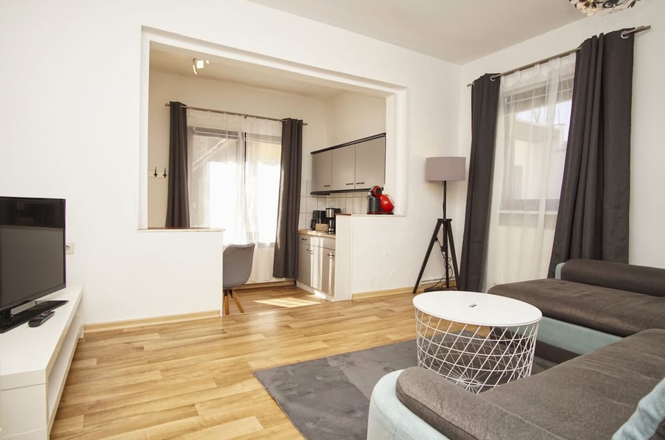 Apartment with Terrace, Bedroom, Kitchen incl.free access to pool and sauna nearby | Living area | Flat-screen TV