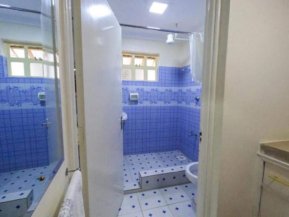 Standard Single Room | Bathroom | Shower, slippers, towels, soap