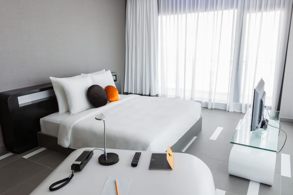 Suite, 1 King Bed, Balcony | In-room safe, desk, blackout drapes, soundproofing