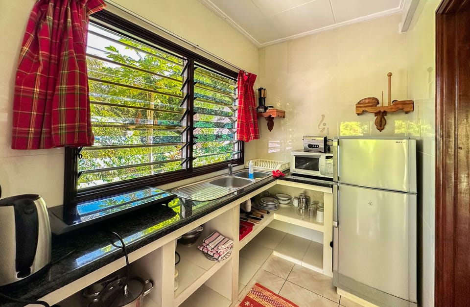 Apartment, 1 Bedroom (Coco Sec) | Private kitchen | Coffee/tea maker, fridge, microwave, stovetop