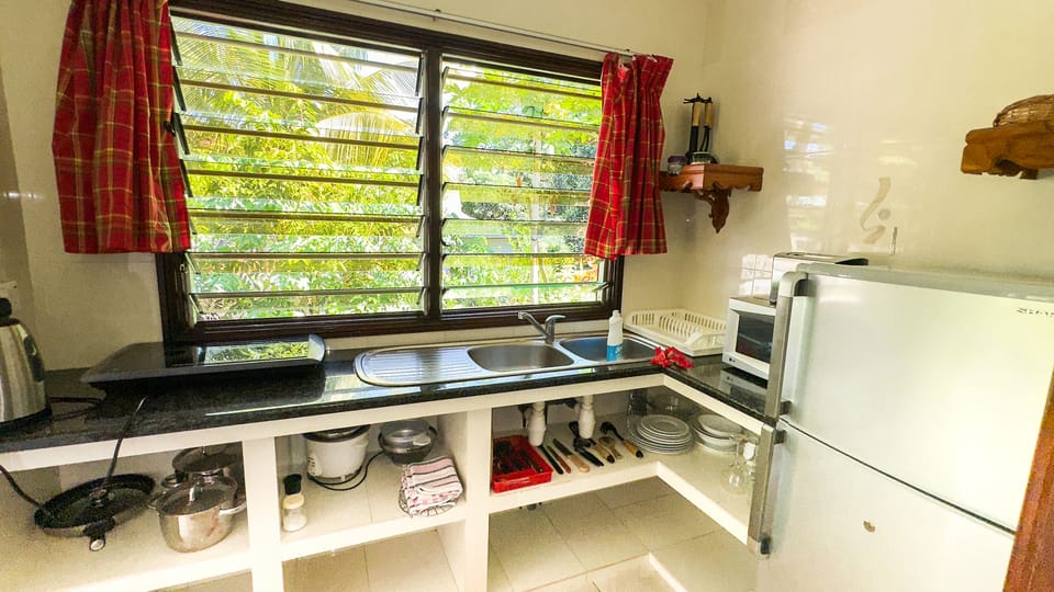 Apartment, 1 Bedroom (Coco Germ) | Private kitchen | Coffee/tea maker, fridge, microwave, stovetop