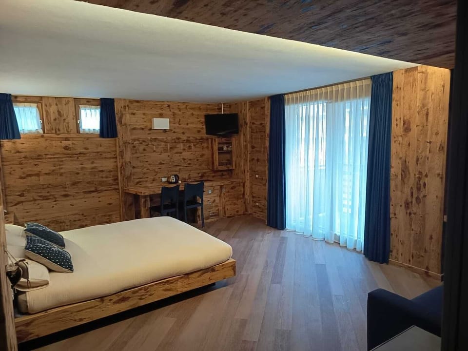 Luxury Quadruple Room, Mountain View | In-room safe, desk, blackout drapes, soundproofing