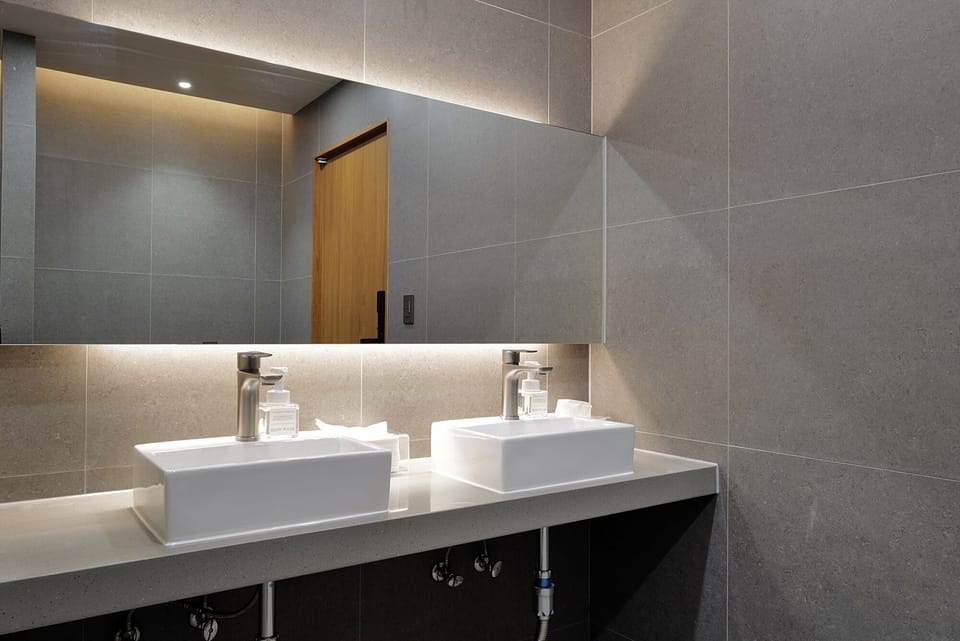 Shower, hair dryer, slippers, towels