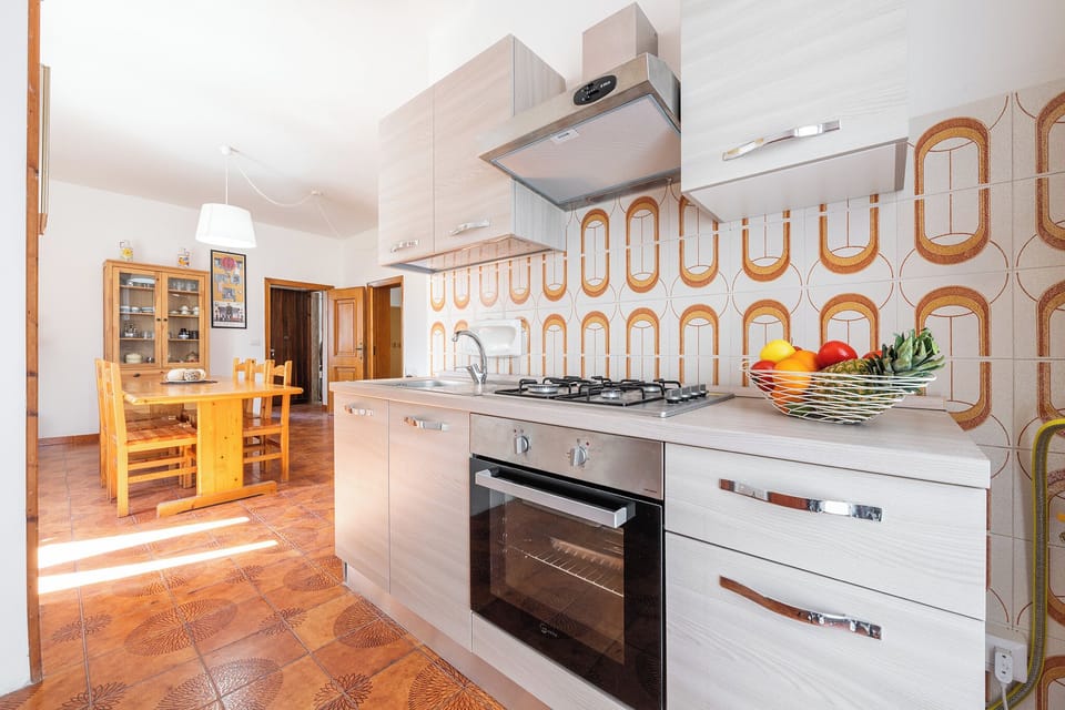 Apartment, 3 Bedrooms | Private kitchen | Full-size fridge, oven, stovetop, cookware/dishes/utensils