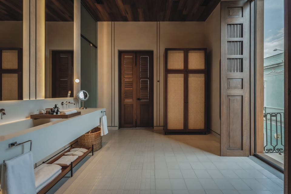 Luxury Suite, Patio | Bathroom | Hair dryer, towels, soap, shampoo