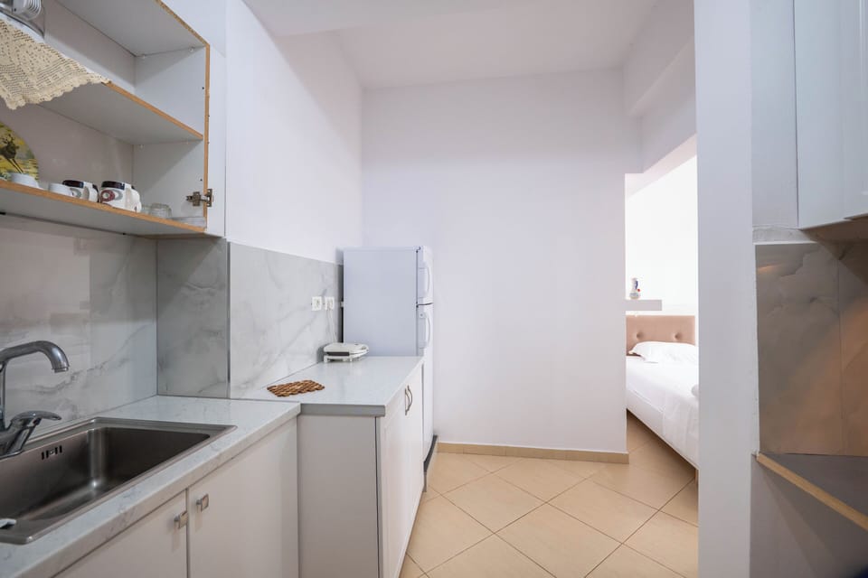 Family Room, Balcony | Private kitchen | Electric kettle