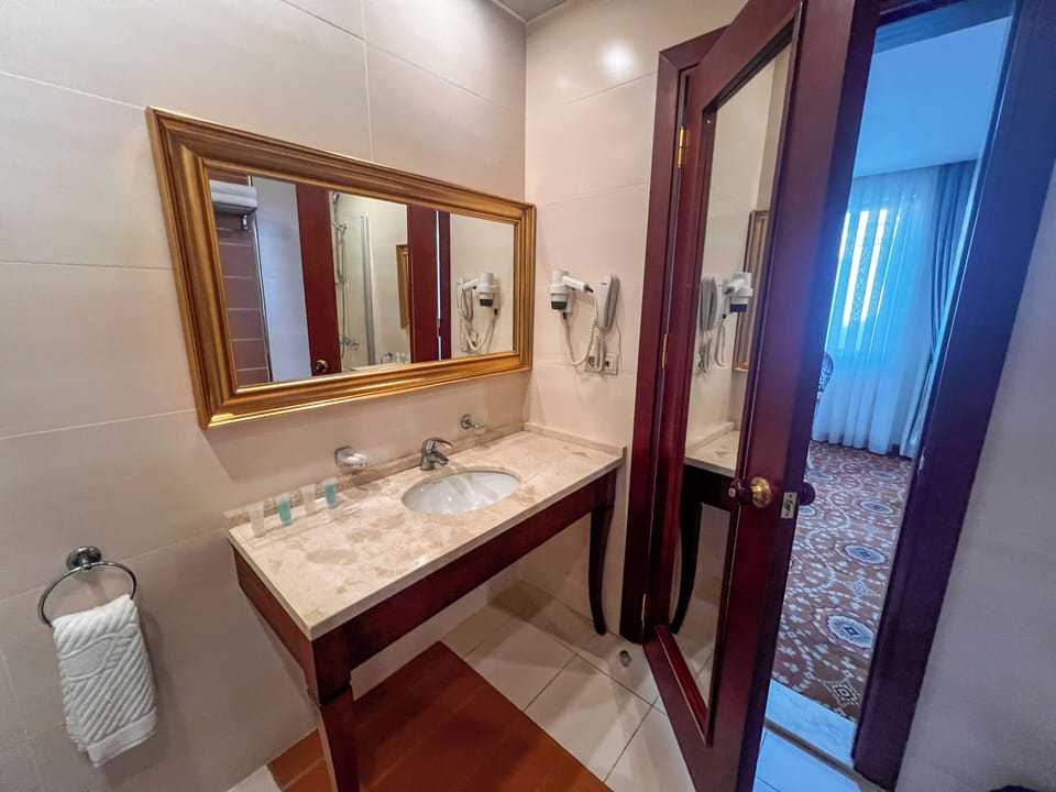 Royal Suite, City View | Bathroom | Rainfall showerhead, free toiletries, hair dryer, slippers
