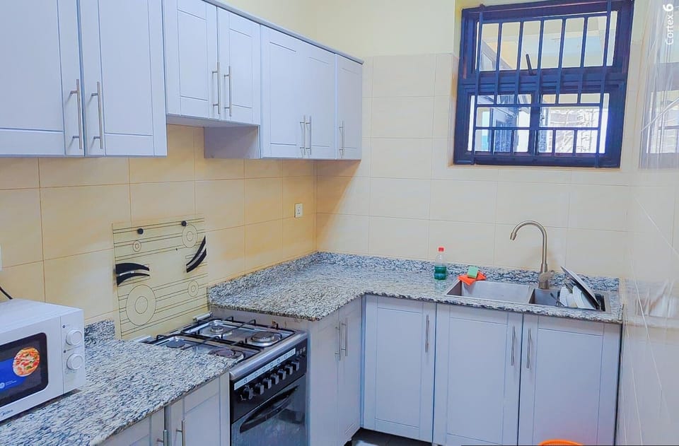 Espresso maker, mini-fridge, oven, electric kettle