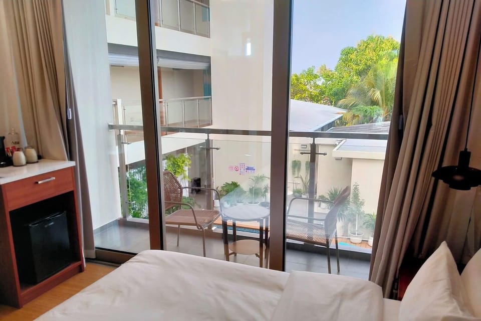 Deluxe Double Room, Balcony | In-room safe, desk, laptop workspace, iron/ironing board