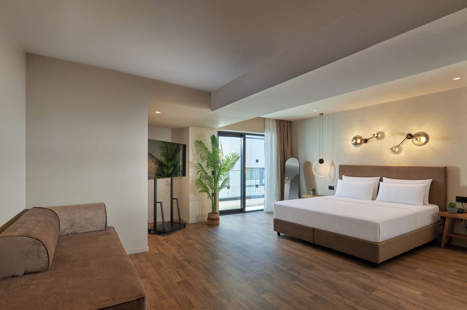 Junior Suite Atrium | Living area | 50-inch Smart TV with digital channels