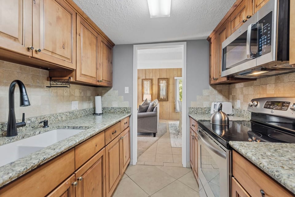 Condo, Multiple Beds, Patio, Garden View (Columbine #301) | Private kitchen | Dining table