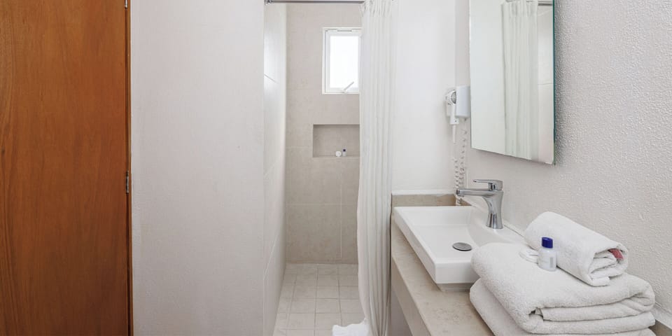Shower, free toiletries, hair dryer, towels