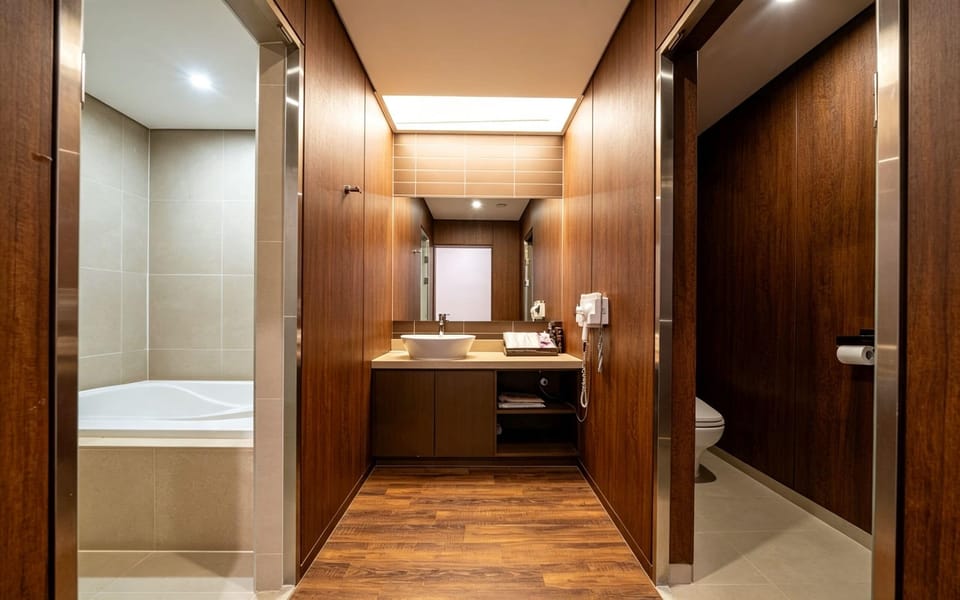 M Business Royal | Bathroom | Shower, hair dryer, slippers, bidet