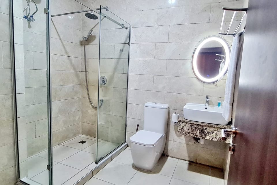 Premier Room | Bathroom | Shower, towels, soap, toilet paper