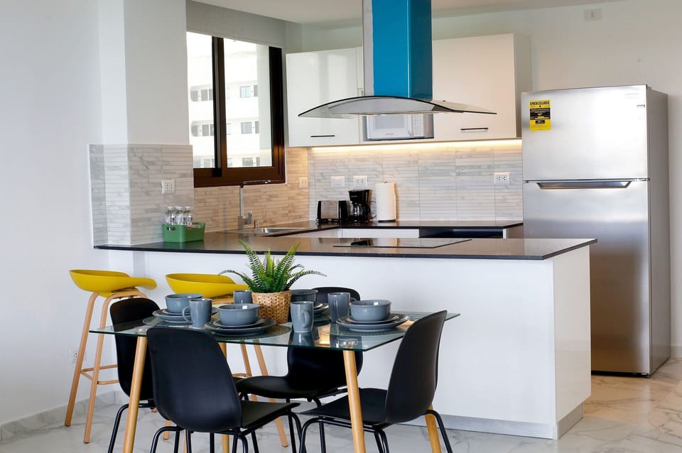 Exclusive Apartment | Private kitchen | Full-size fridge, microwave, cookware/dishes/utensils, paper towels