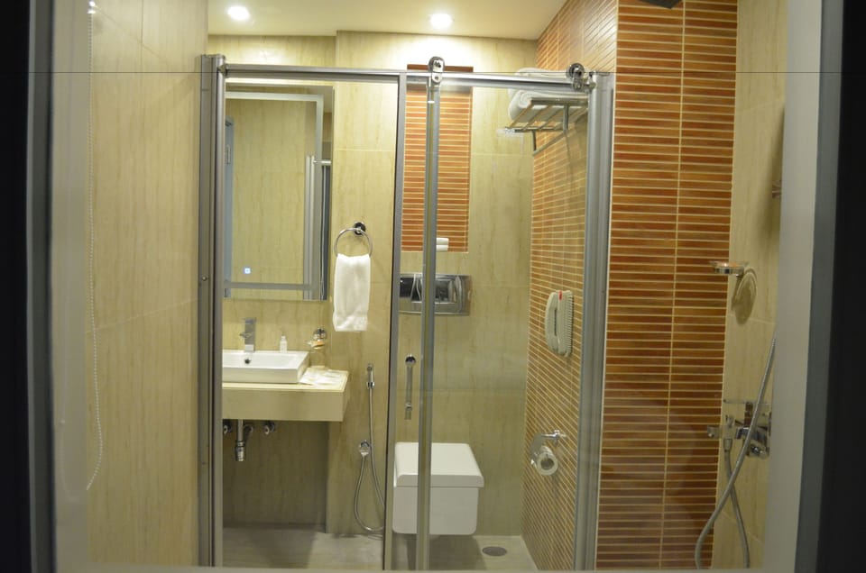 Shower, free toiletries, hair dryer, slippers
