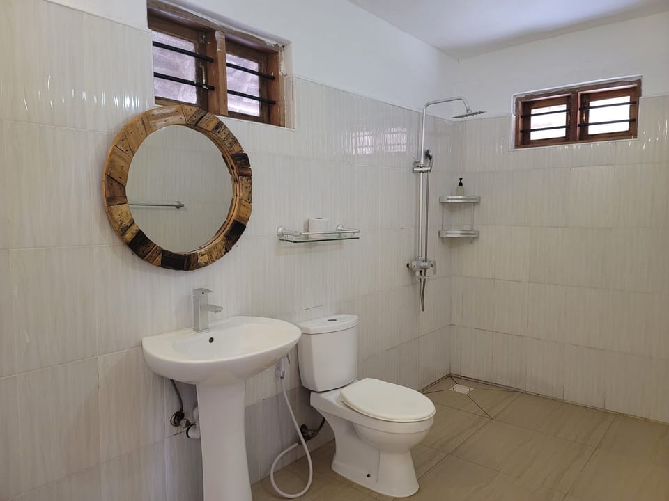 Deluxe Double Room, Patio, Beach View | Bathroom | Shower, free toiletries, bidet, towels