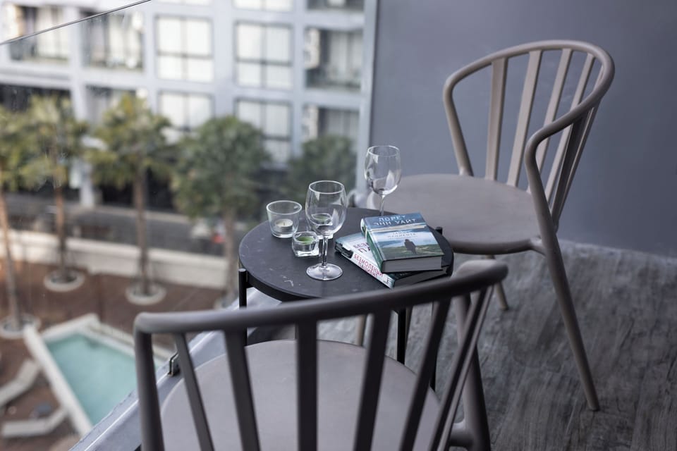 Deluxe Condo, Balcony, Pool View | Outdoor dining