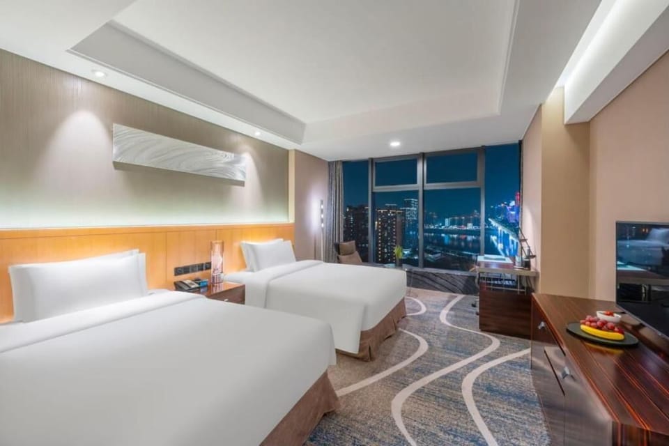 Deluxe Twin Room, River View | In-room safe, desk, laptop workspace, blackout drapes