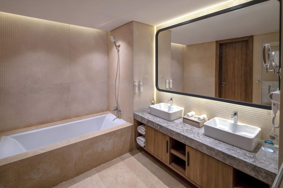 Two Bedroom Skyline Suite With Infinity Pool | Bathroom | Designer toiletries, hair dryer, bathrobes, slippers