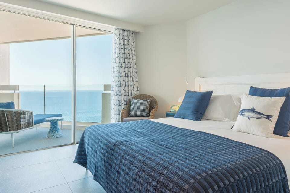 Suite | Premium bedding, down comforters, desk, blackout drapes