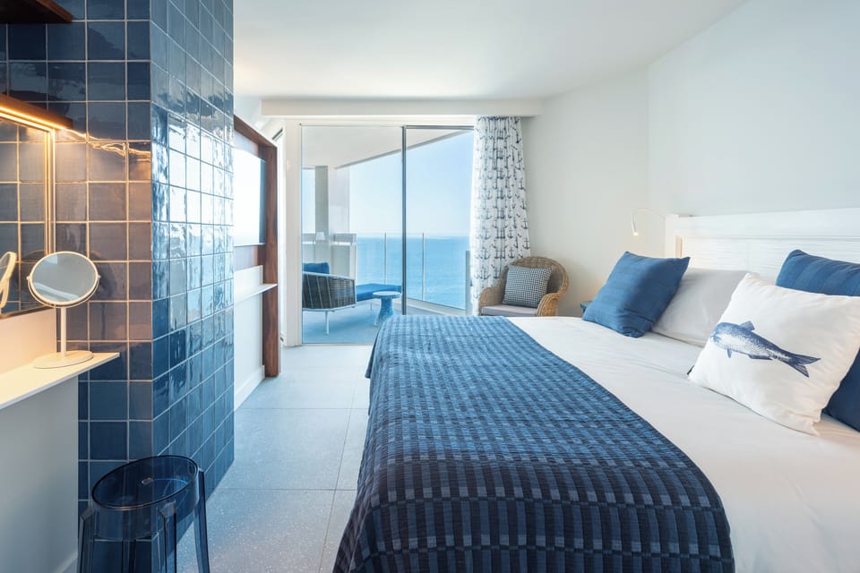 Suite | Premium bedding, down comforters, desk, blackout drapes