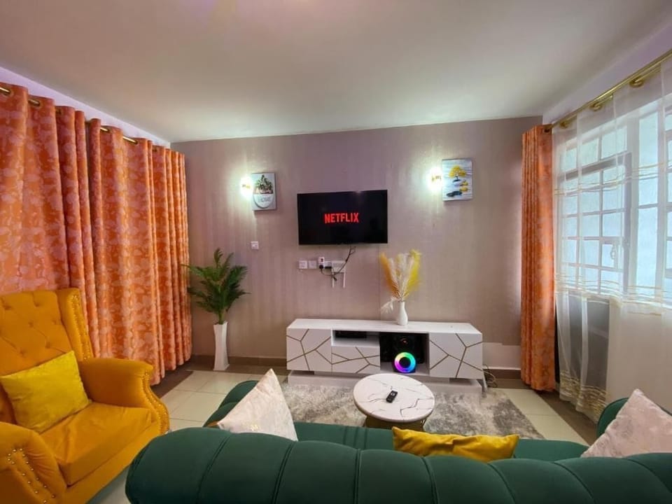 Apartment, Balcony, City View | Living area | Flat-screen TV