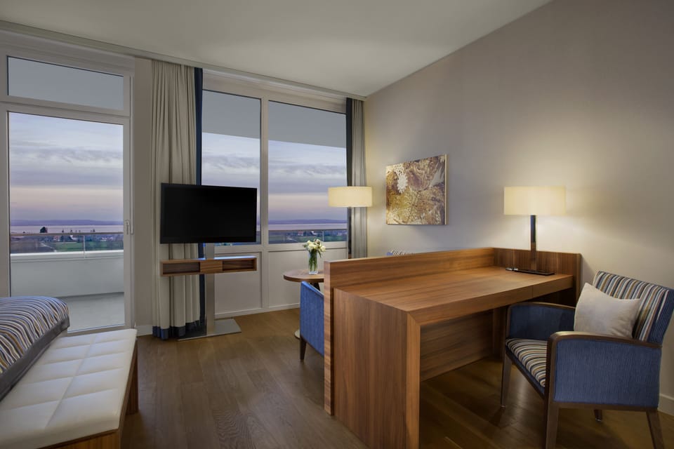 Superior Double Room, Lake View | Living room | Flat-screen TV