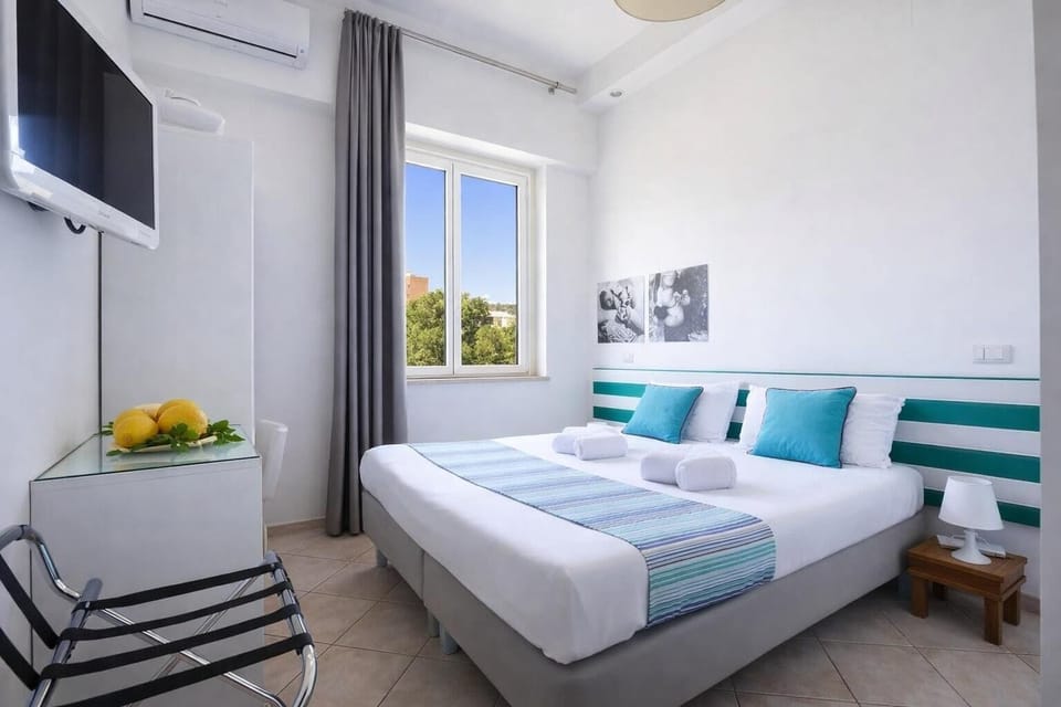 Economy Double or Twin Room | Minibar, in-room safe, desk, free WiFi