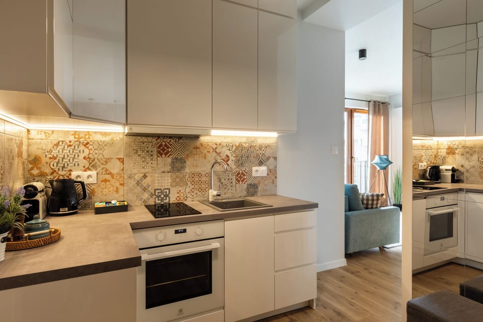 Deluxe Studio Suite, Air conditioning | Private kitchen | Fridge, oven, stovetop, dishwasher