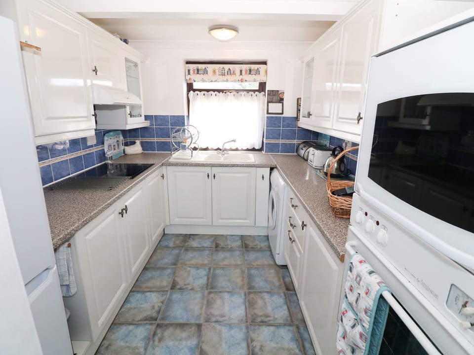 Fridge, microwave, cookware/dishes/utensils