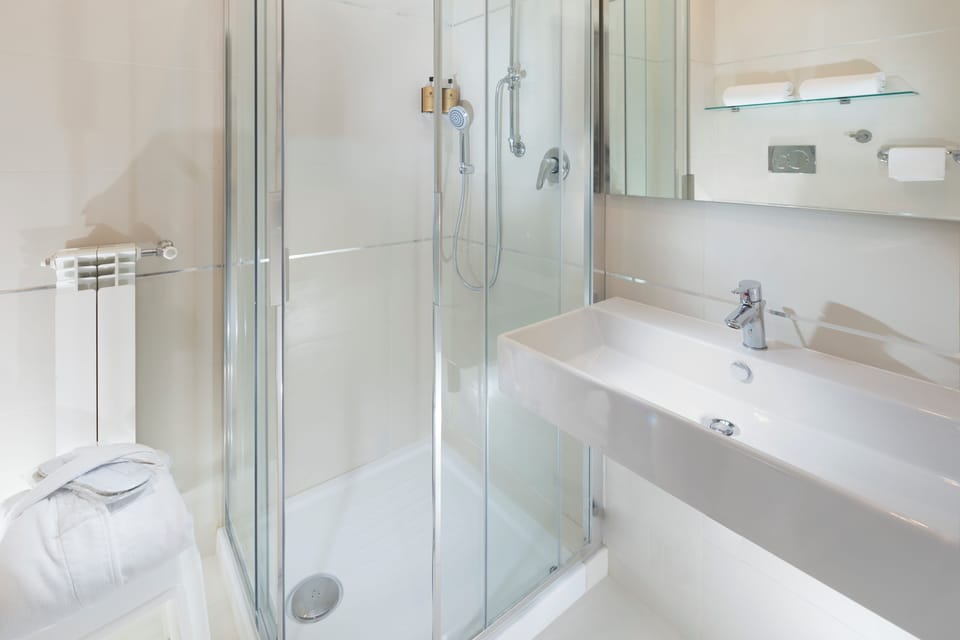 Deluxe Quadruple Room, Balcony, Sea View | Bathroom | Bathrobes, slippers