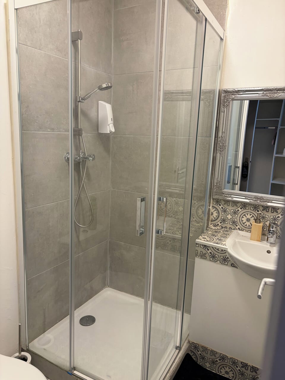 Shower, rainfall showerhead, towels, soap