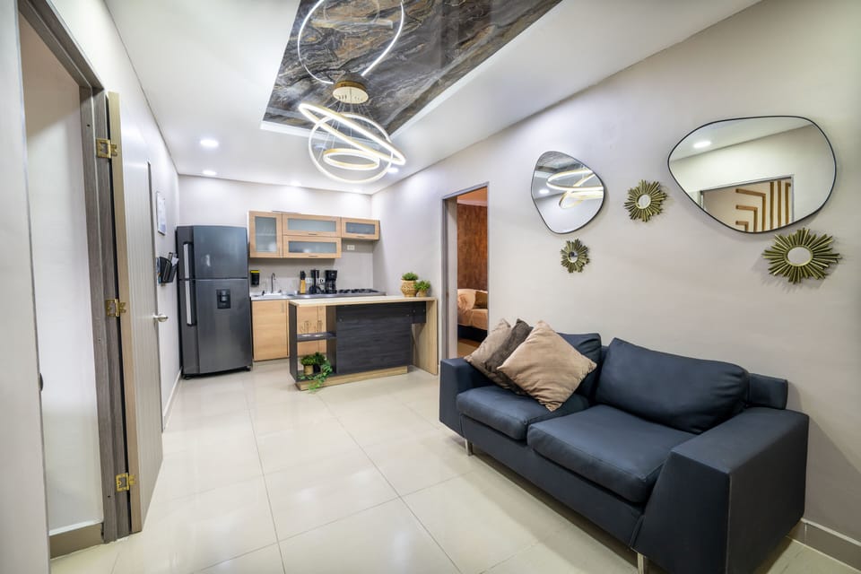 Apartment | Living area | 65-inch flat-screen TV with digital channels, video-game console