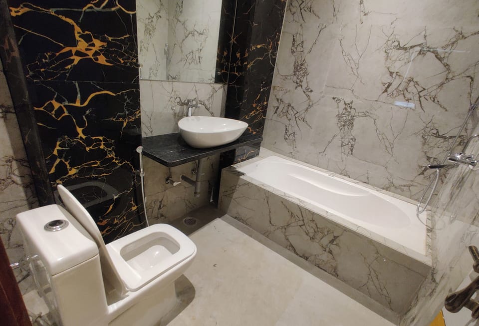 Family Triple Room, City View | Bathroom | Slippers, towels, soap, shampoo
