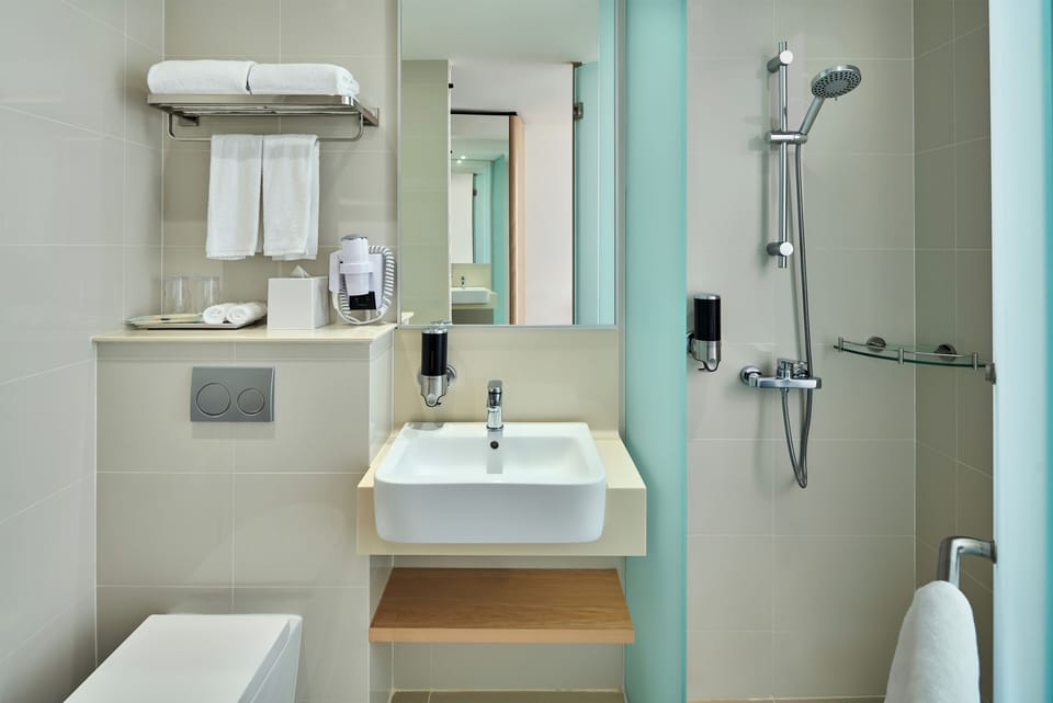 Shower, free toiletries, hair dryer, slippers