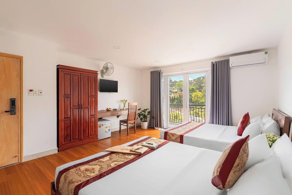 Deluxe Quadruple Room, 2 Queen Beds, Air conditioning, City View | Desk, laptop workspace, free WiFi